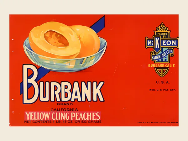 Red Burbank Brand peach can label with a glass bowl of yellow cling peaches, McKeon Canning Company, Burbank, about 1922